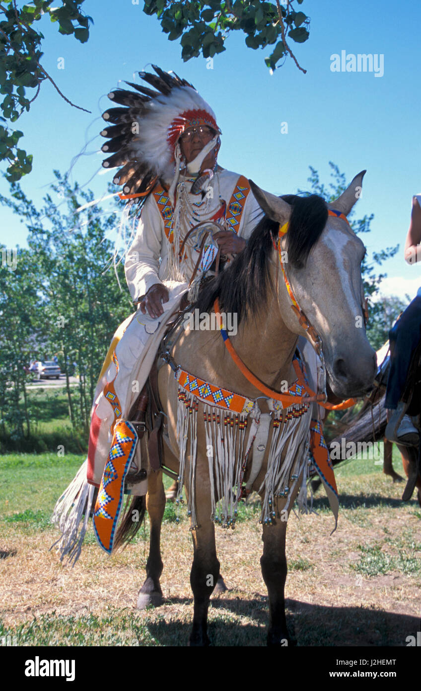 Blackfeet elder Kicking Woman dressed in traditional beaded