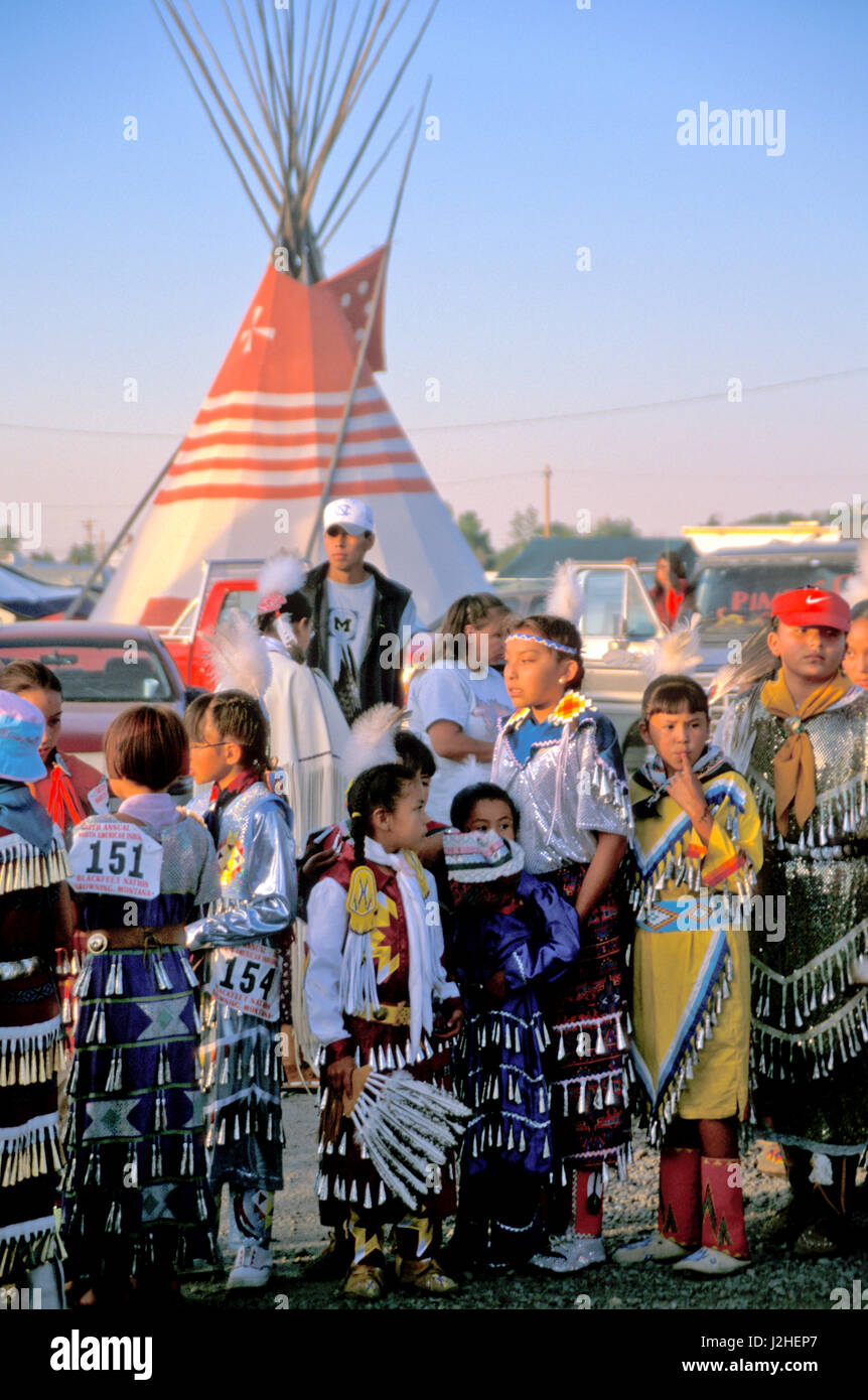 A group of young jingle dancers line up before Grand Entry during a pow