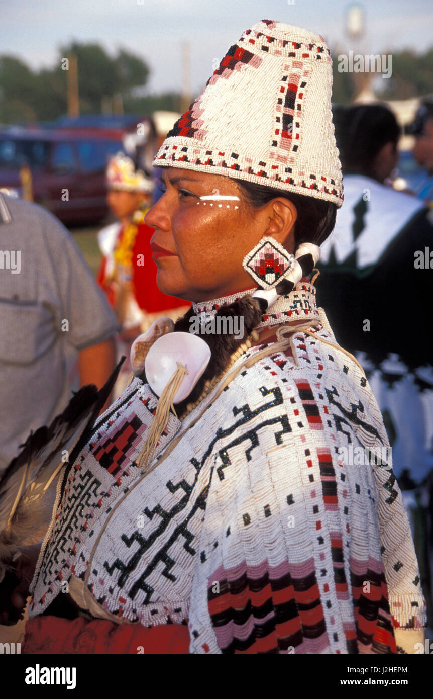 Woman dressed in fully beaded cylinder hat and cape during the Blackfeet Indian Days Festival, Browning Montana Stock Photo