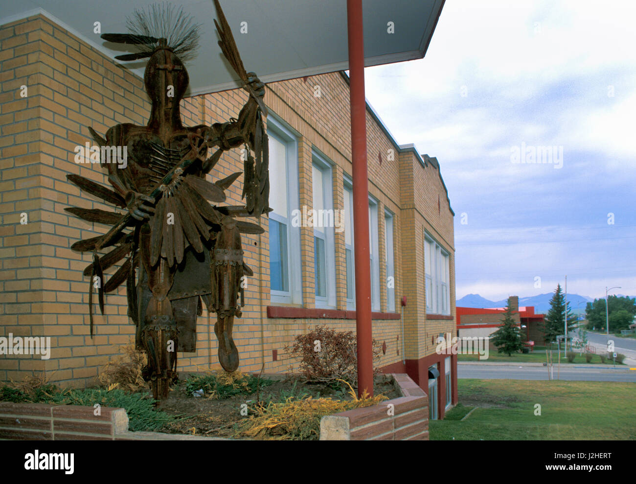 Metal art sculpture located at the front entrance to the Blackfeet high school located in Browning Montana on the Blackfeet Nation Indian Reservation Stock Photo