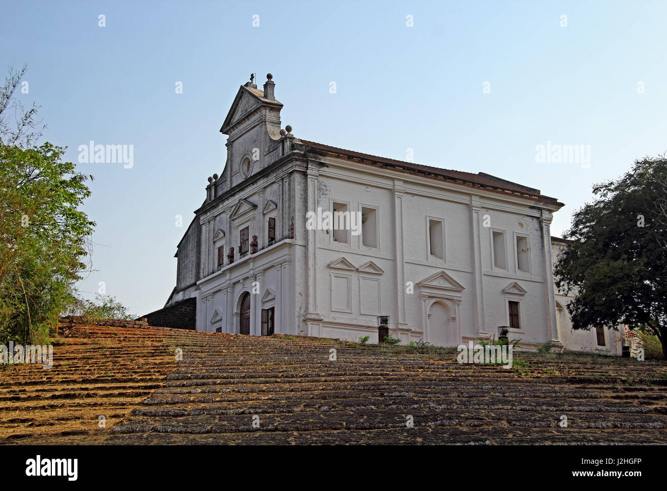 Our Lady of the Mount Chapel with the ramp staircase in laterite stones in Monte Hill in Old Goa, India. The Monte Music Festival is held here. Stock Photo