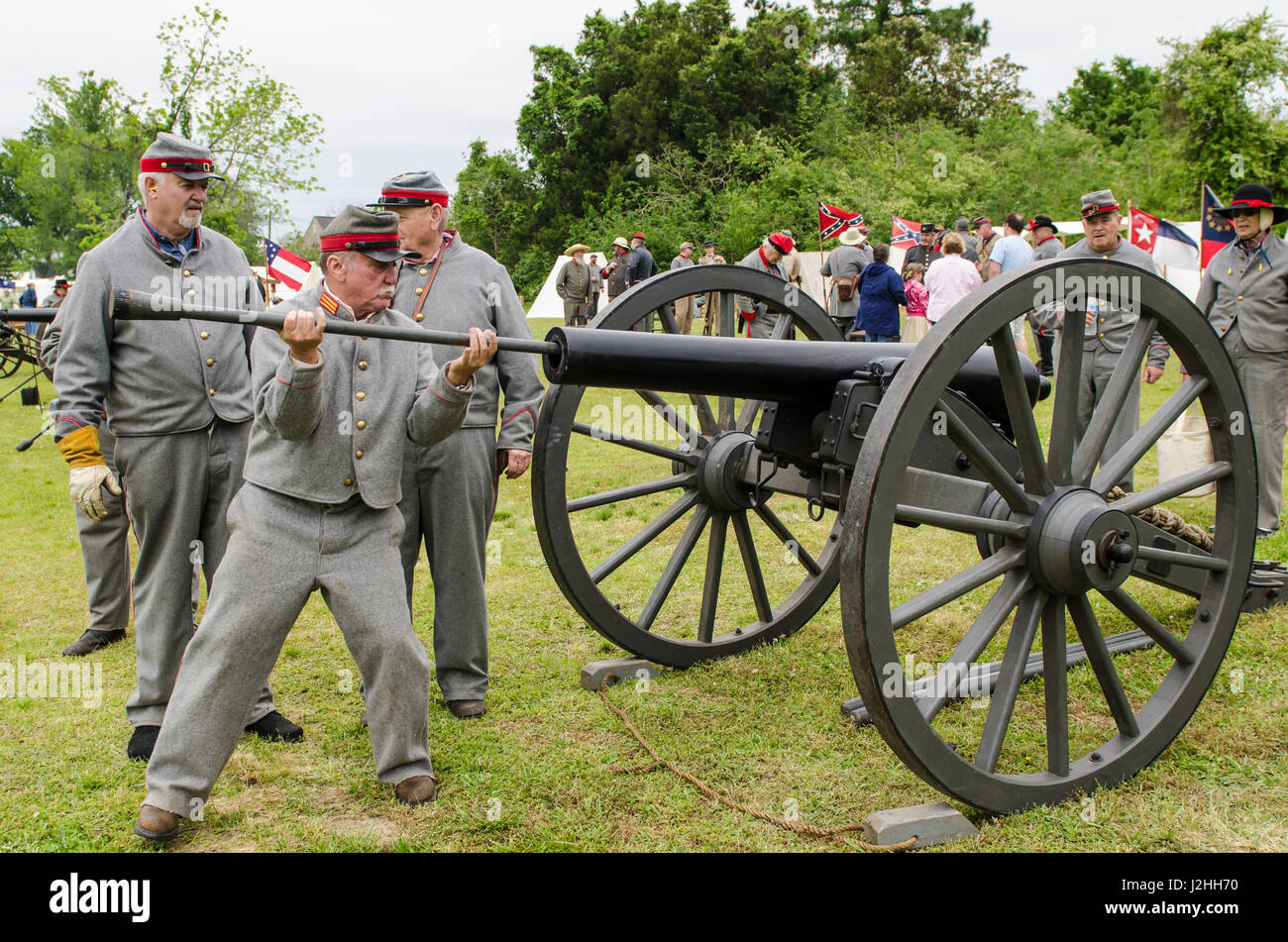 Confederate artillery unit cannon action during Thunder on the Roanoke Civil War reenactment in Plymouth, North Carolina, USA. Stock Photo