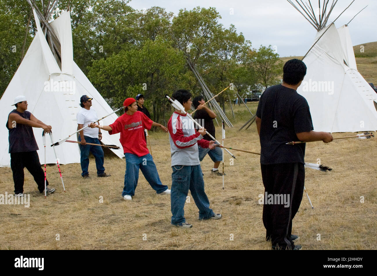 Three Affiliated tribes (Mandan, Arikara and Hidatsa) today continue to teach their children many of the traditional games of their ancestors such as the arrow toss game on the Fort Berthold Indian Reservation, North Dakota Stock Photo