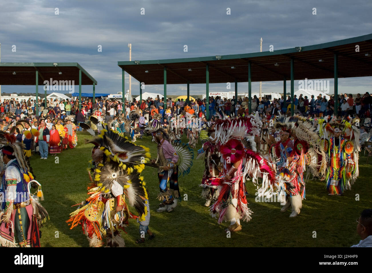 Colorful pow wow dancers and participants during Grand Entry in the