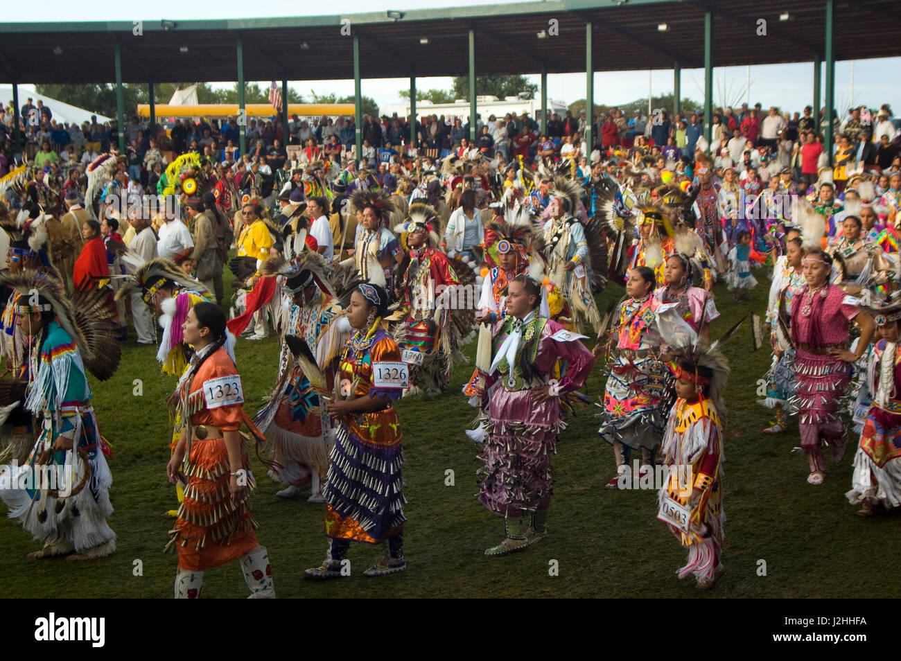 Colorful pow wow dancers and participants during Grand Entry in the