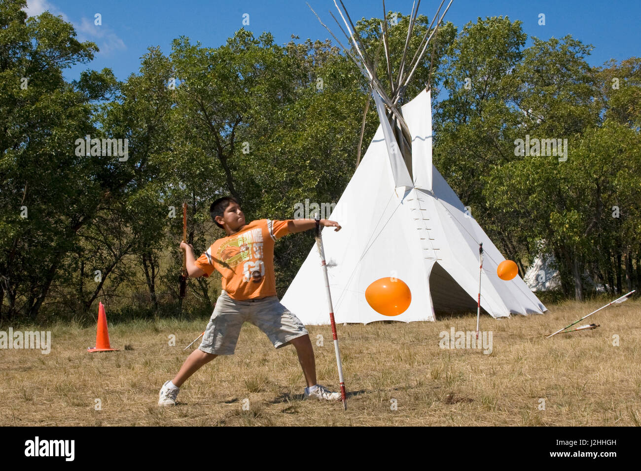Three Affiliated tribes (Mandan, Arikara and Hidatsa) continue to teach their children many of the traditional games of their ancestors such as the arrow toss game on the Fort Berthold Indian Reservation, North Dakota Stock Photo
