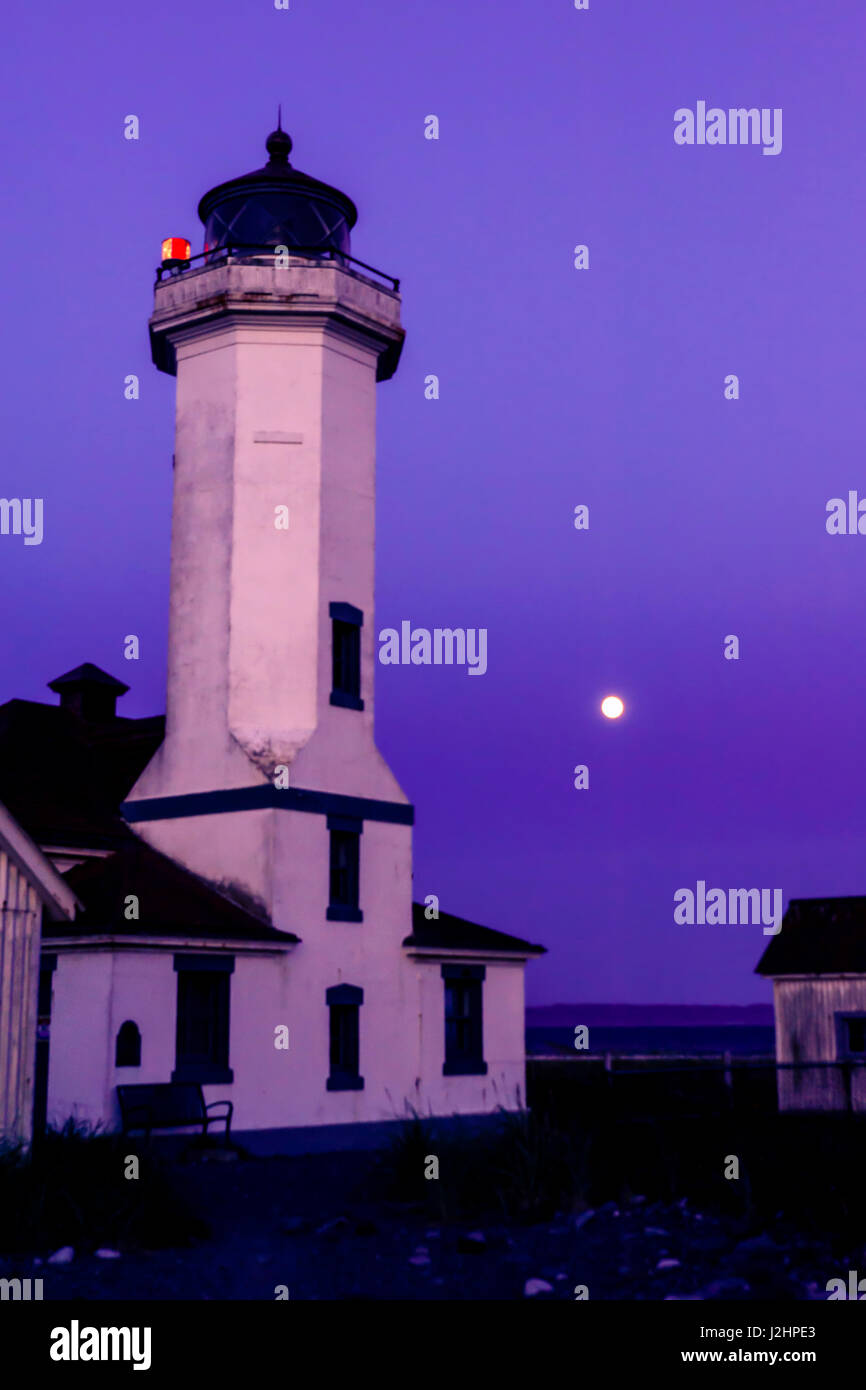 USA, Washington, Port Townsend. Super Moon behind the Point Wilson Lighthouse, the turning point from the Strait of Juan de Fuca into Admiralty Inlet. Stock Photo