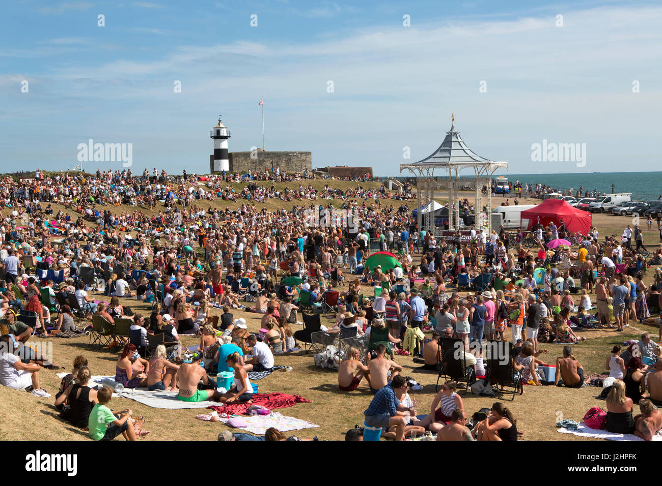 Huge crowd at the Bandstand at Southsea during one of the many free events held in 2016. A great place for local talent to showcase to a summer crowd. Stock Photo