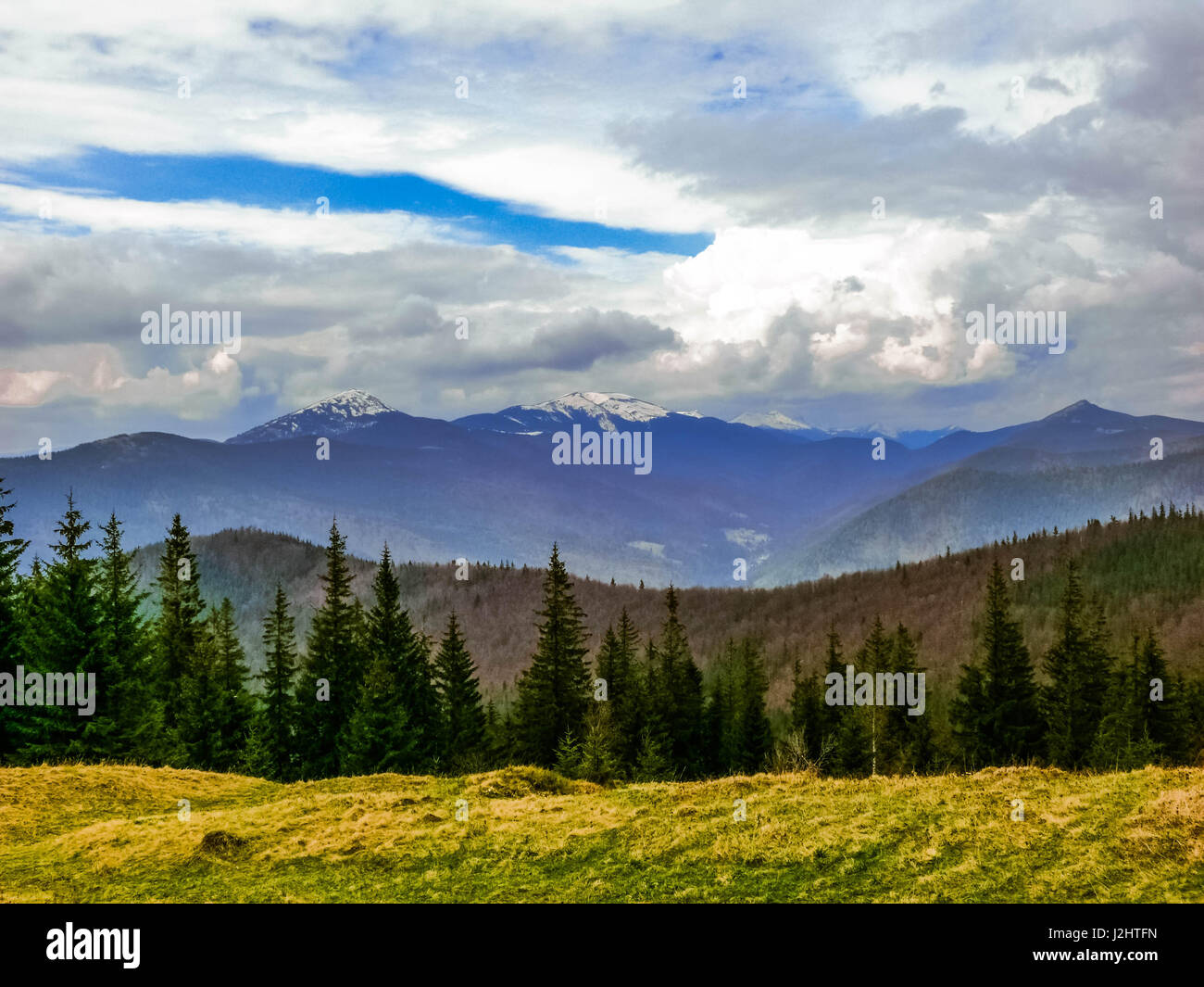 Mountains and cloudy sky view background Stock Photo - Alamy