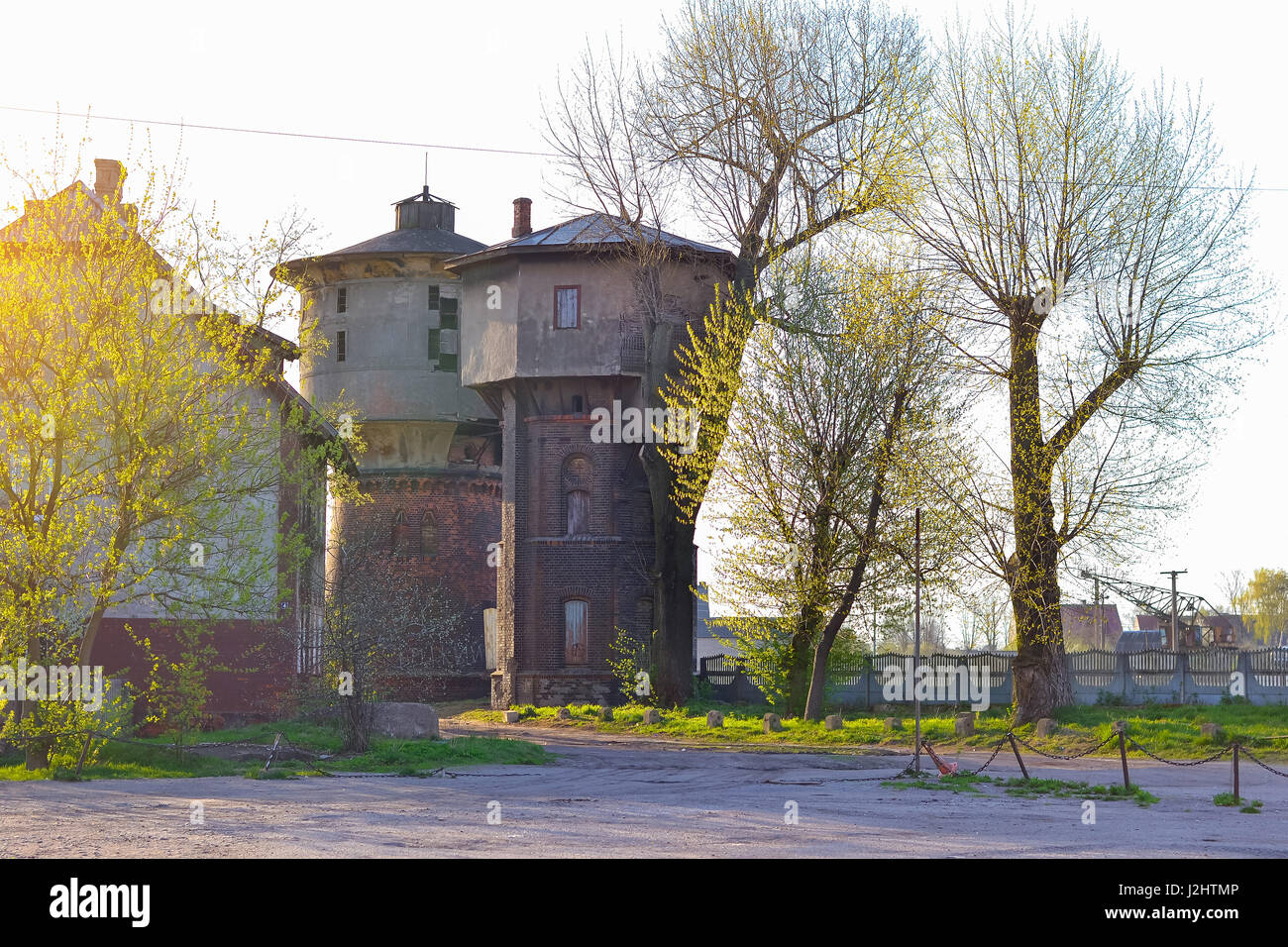 Water tower at station of Western railway Gumbinnen in East Prussia. Old German architecture in town Gusev, Kaliningrad region, Russia. Morning sunlig Stock Photo