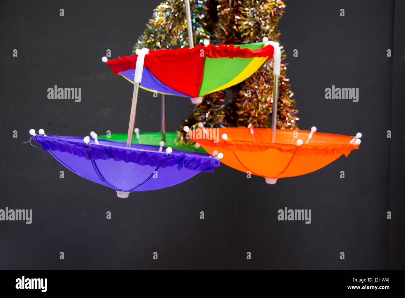 Hanging umbrellas of various color in the market place Stock Photo Alamy