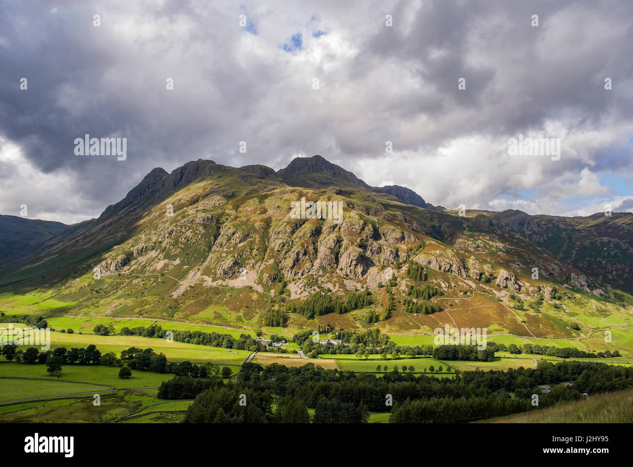 High Raise fell in the Great Langdale valley. Dungeon Ghyll hotel at the bottom Stock Photo