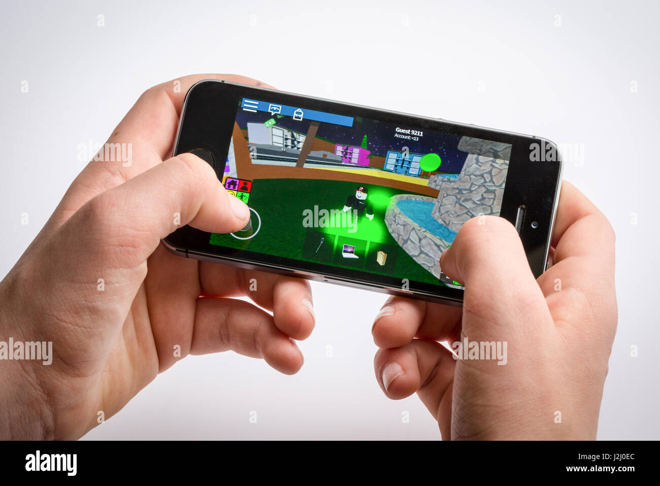 Teenage Boy Playing Roblox Game On An Iphone Stock Photo Alamy
