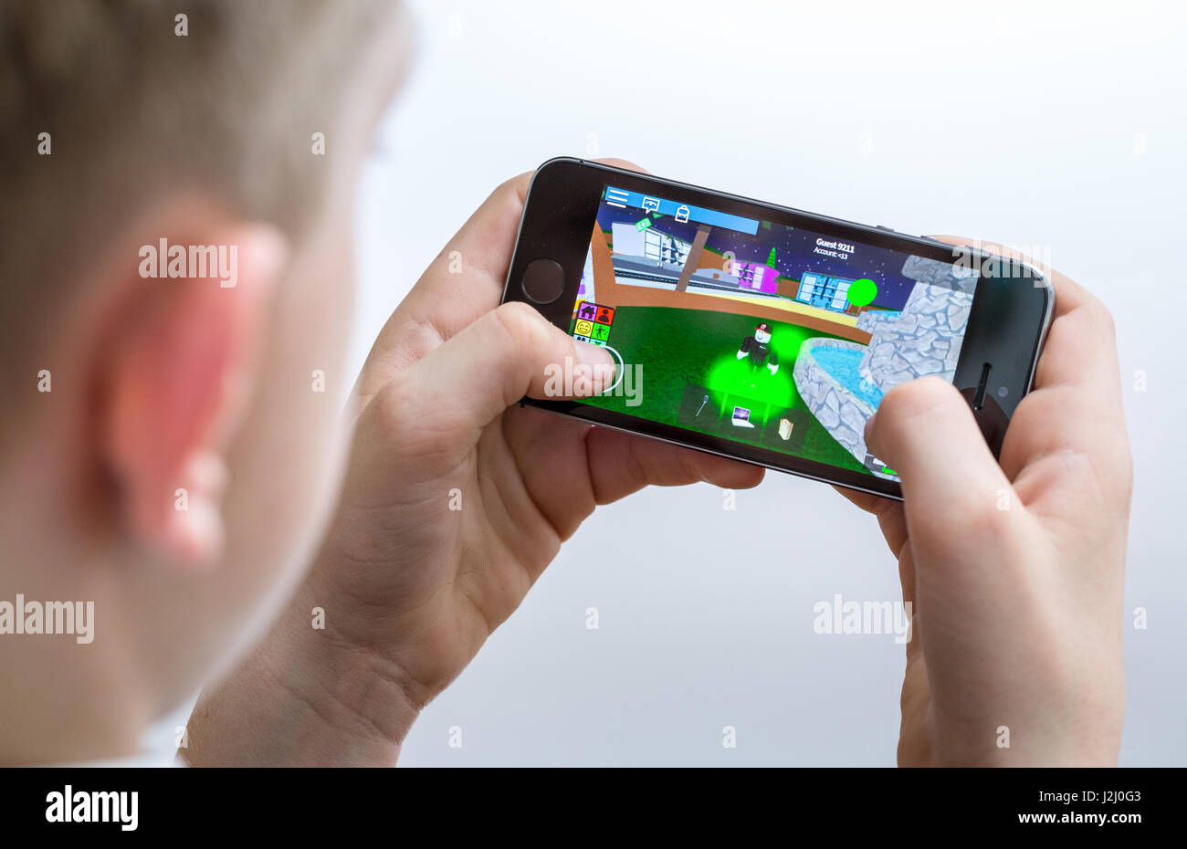 In this photo illustration the Roblox logo is seen on a smartphone screen  in front of Roblox website. (Photo by Pavlo Gonchar / SOPA Images/Sipa USA  Stock Photo - Alamy