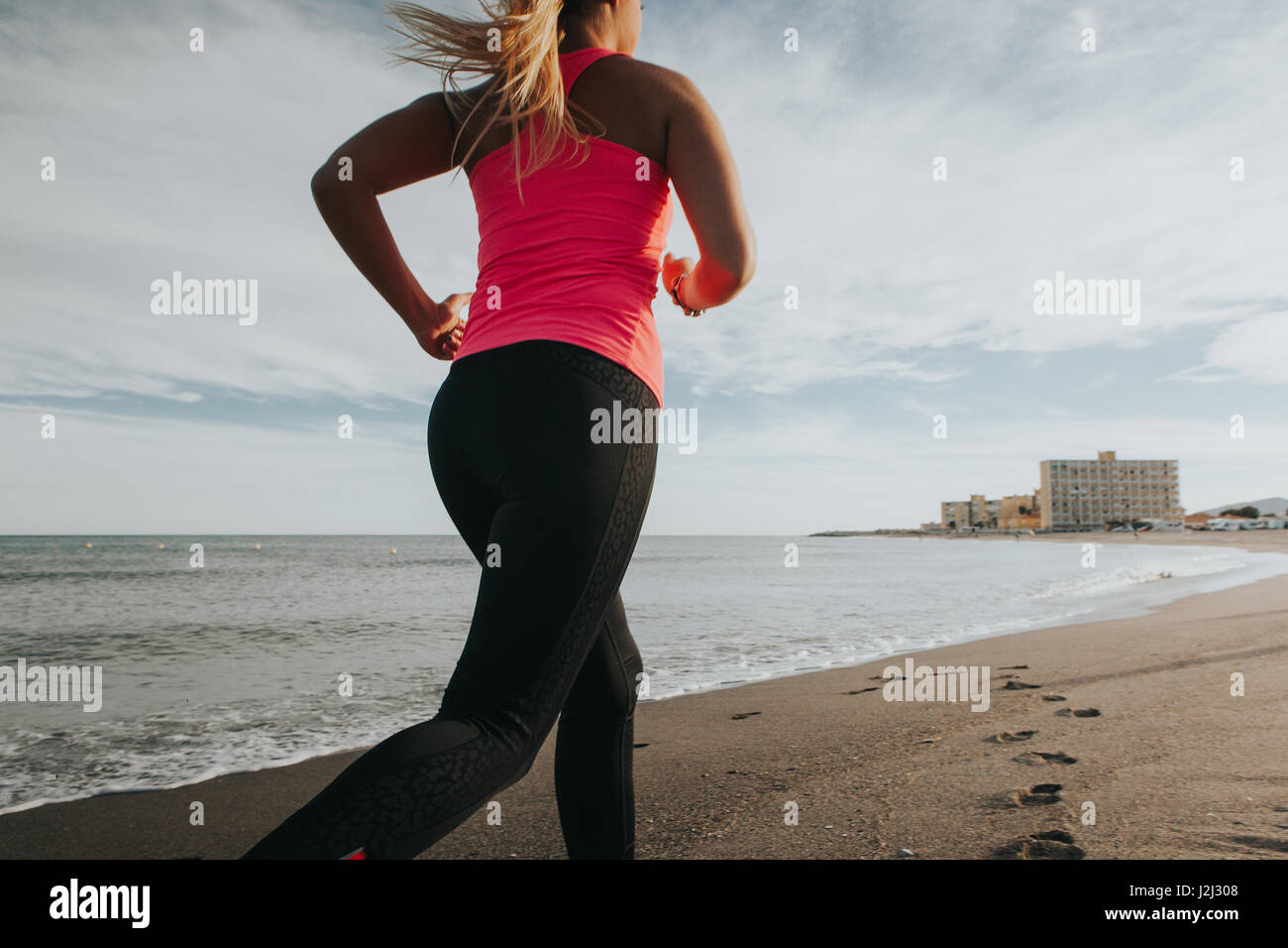 fitness-blonde-girl-running-high-resolution-stock-photography-and