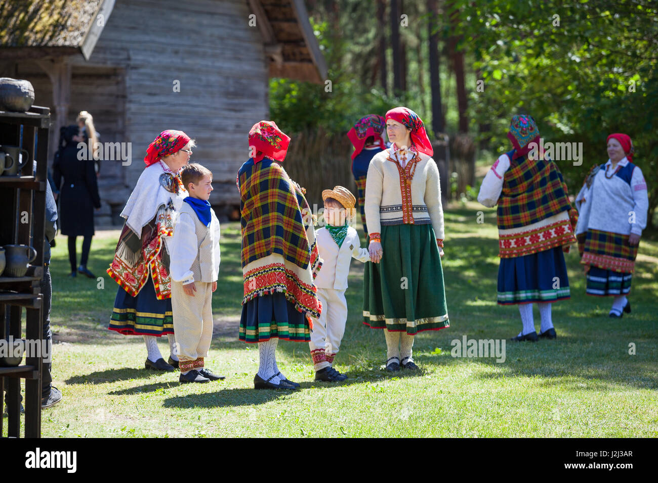 RIGA, LATVIA - 12 JUN 2016: Latvian dancers in national costumes. Cultural event in Latvian Ethnographic Museum. Stock Photo