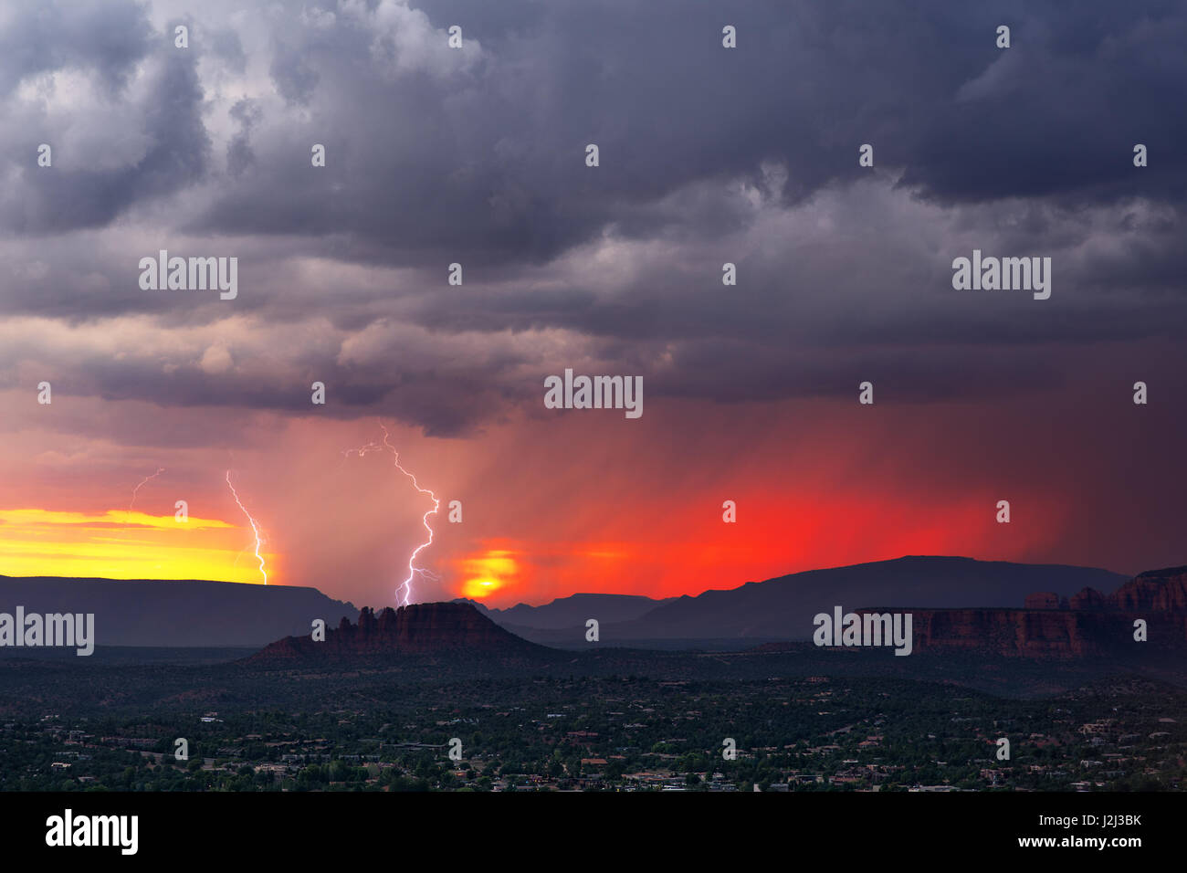 Lightning storm at sunset Stock Photo - Alamy