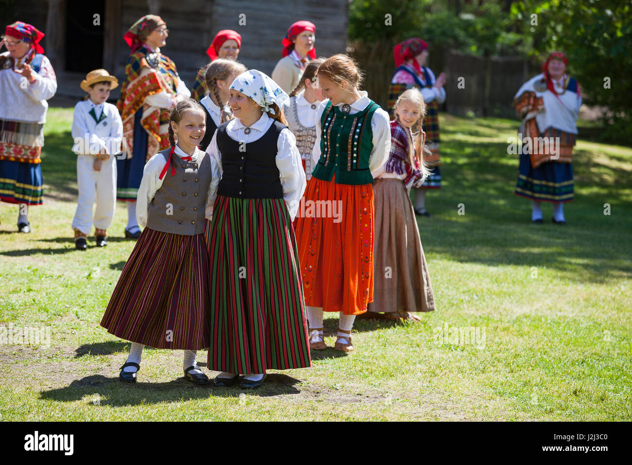 RIGA, LATVIA - 12 JUN 2016: Latvian dancers in national costumes. Cultural event in Latvian Ethnographic Museum. Stock Photo