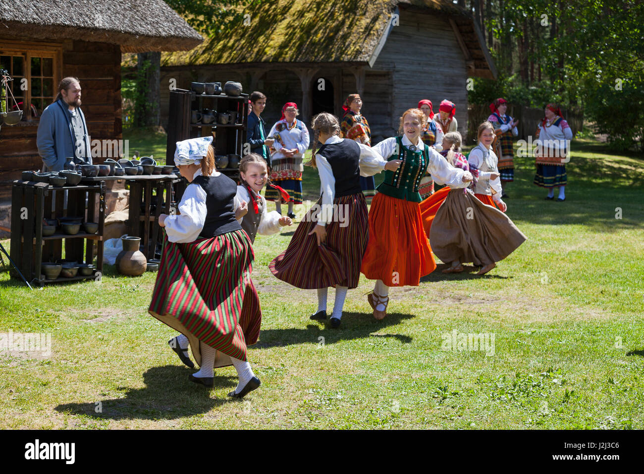 RIGA, LATVIA - 12 JUN 2016: Latvian dancers in national costumes. Cultural event in Latvian Ethnographic Museum. Stock Photo