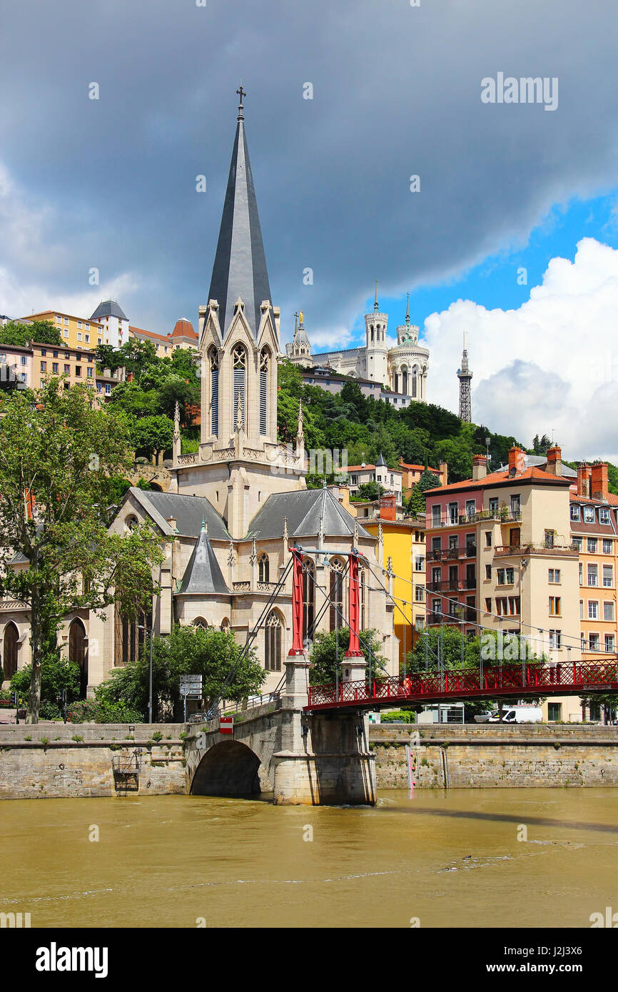 St. Georges church and St. Georges bridge over Saone river, with Basilica of Notre-Dame de Fourviere on the background, Lyon, France Stock Photo