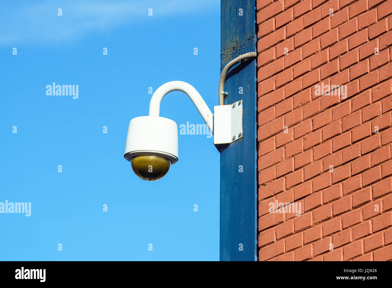 High tech overhead security camera with dark thunderstorm sky Stock