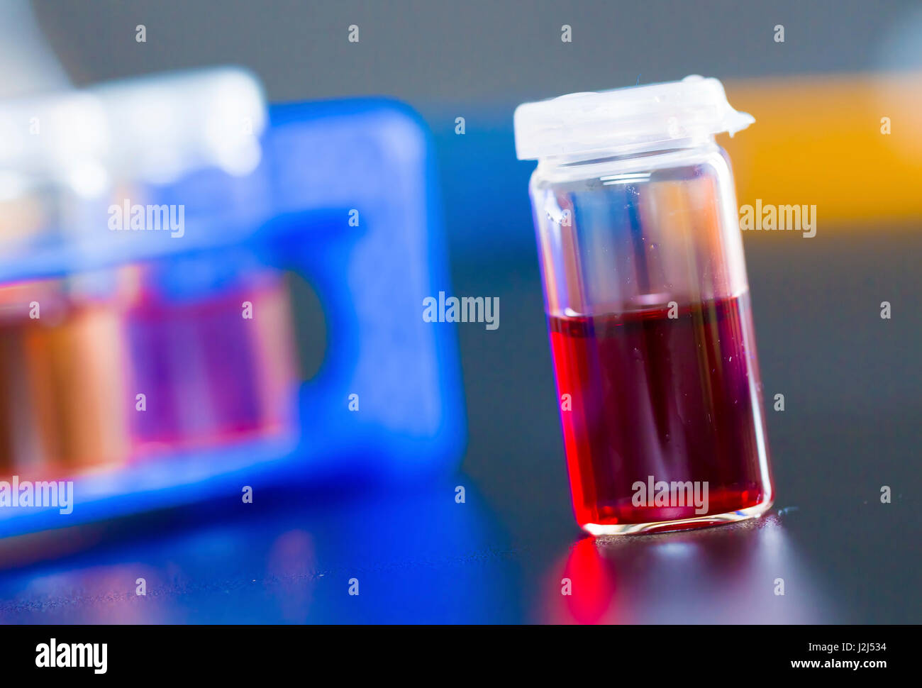 Vial containing sample, studio shot. Stock Photo