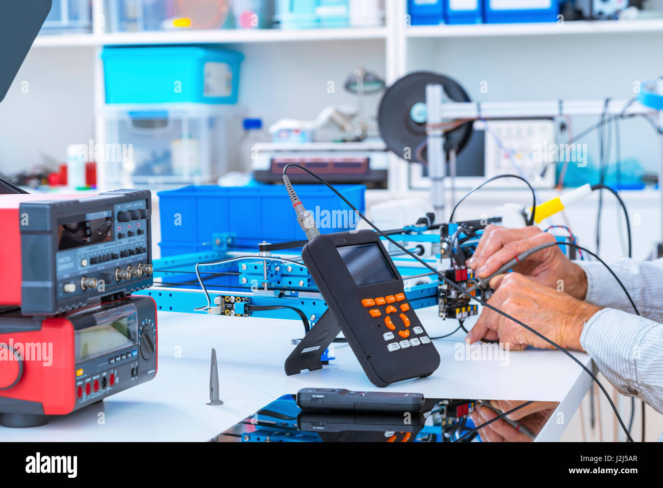 Person working in electronics laboratory. Stock Photo