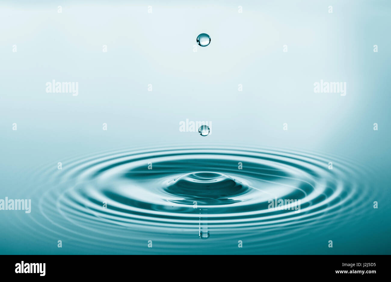 Water droplet on water surface Stock Photo Alamy