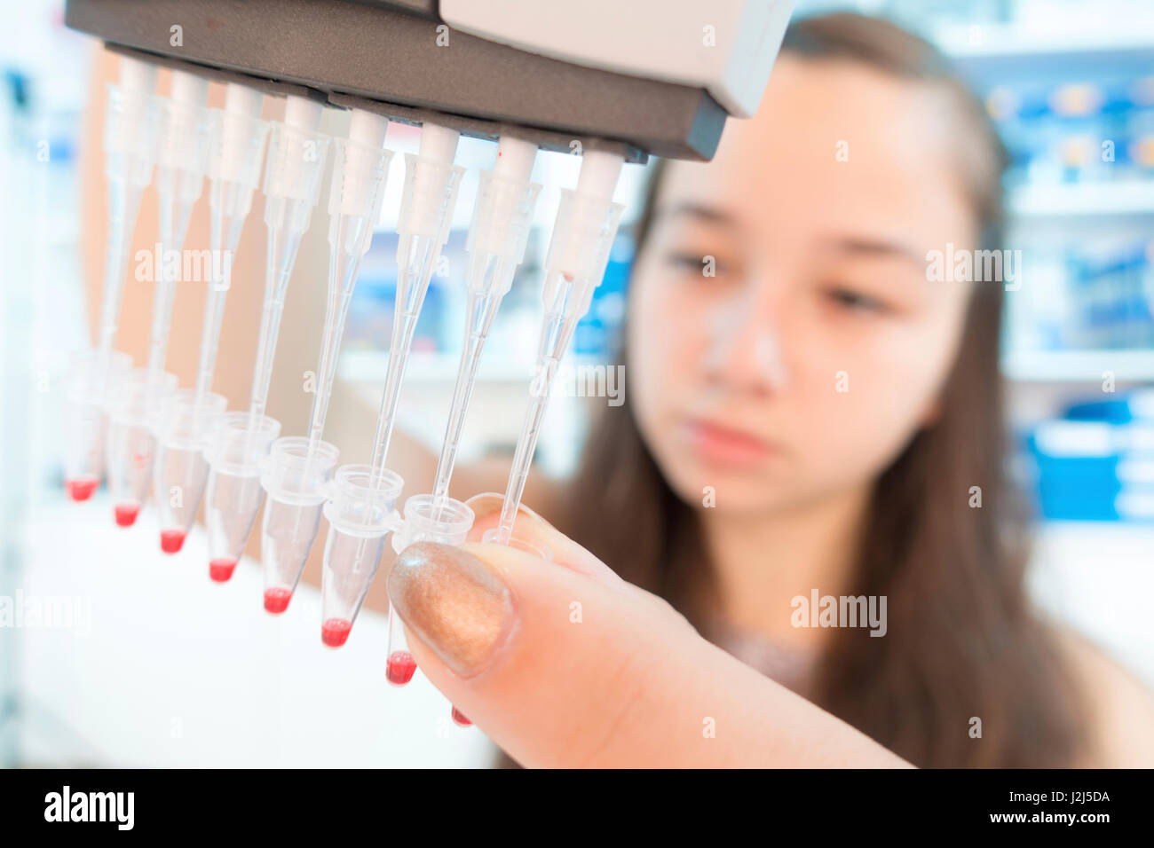 Chemistry student using multi pipette Stock Photo Alamy