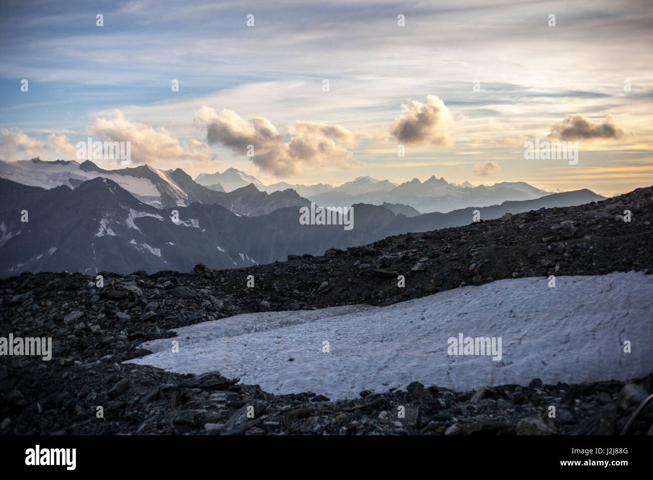 Morning mood in front of mountain landscape, snow, mountain range, upraising, mountain, clouds, moody, summit, view into distance, trekking, Switzerland, Tracuit, Zinal, series Tracuit, sport, stones, snow field, snow tongue, Stock Photo
