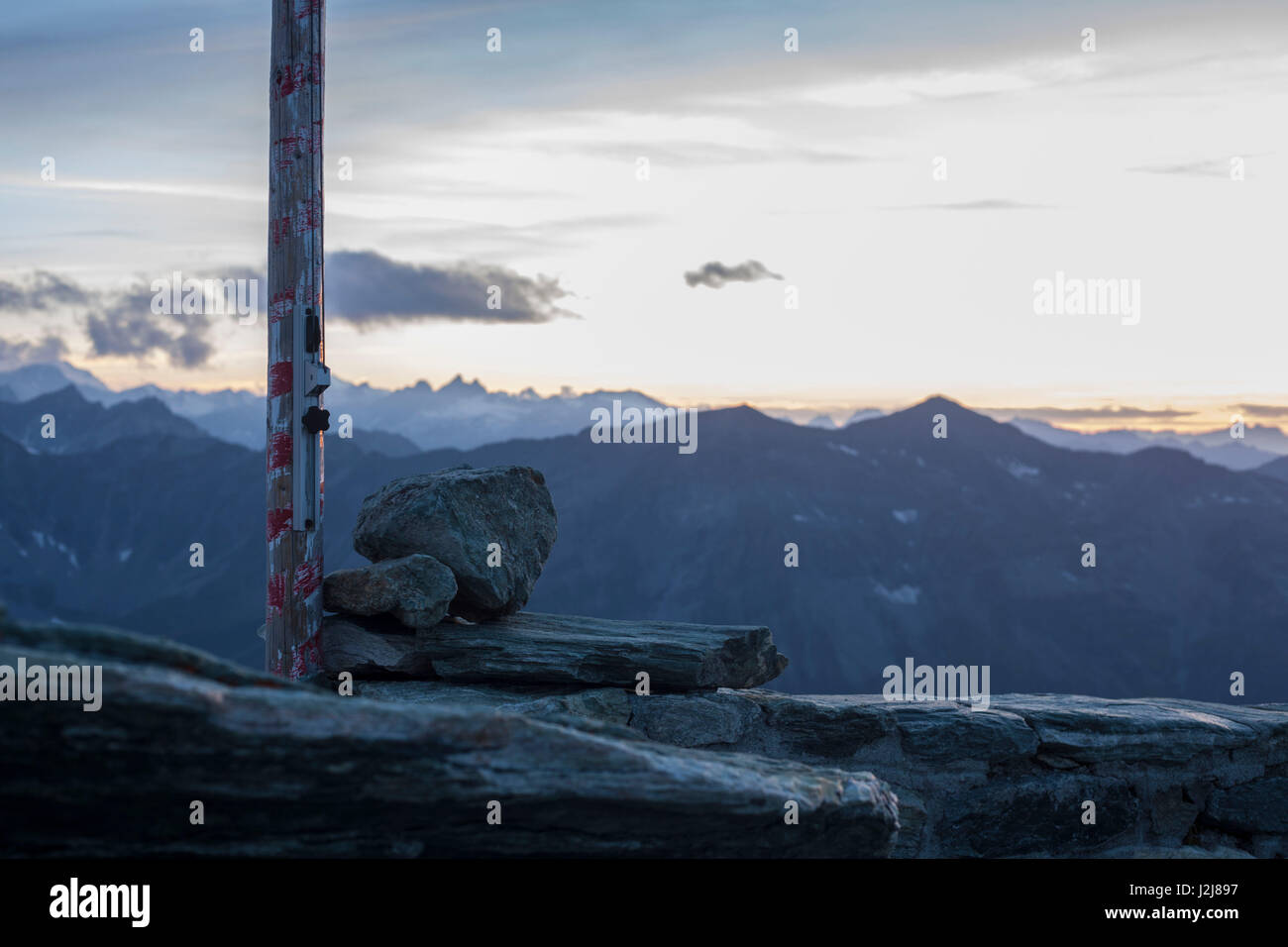 Lonesome sundown, mountain range, flagpole, loneliness, alone, sadly, way, guidiance, lost, moody, summit, Switzerland, Tracuit, Zinal, series Tracuit, glacier Stock Photo