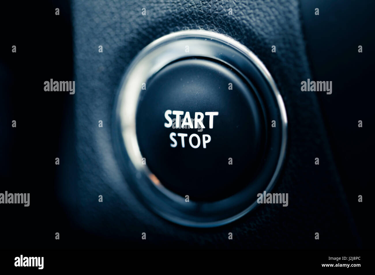 The start stop button of a car. Symbol for Begin and end, drive, engine and beginning Stock