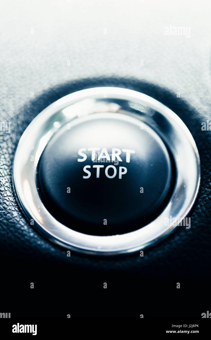 The start stop button of a car. Symbol for Begin and end, drive, engine and beginning. Stock Photo
