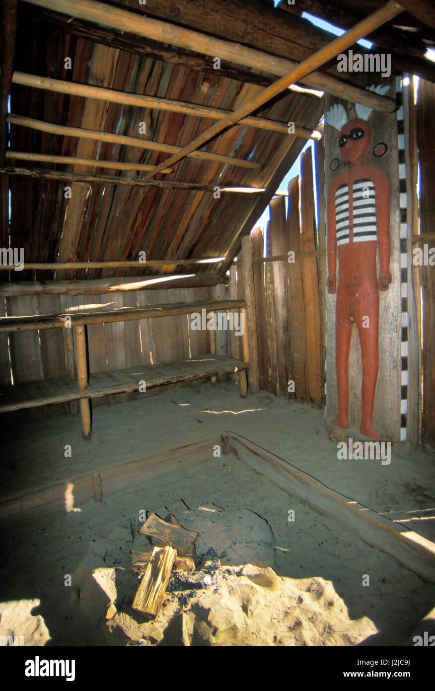 Inside a Chinook dwelling called a Longhouse made from cedar planks