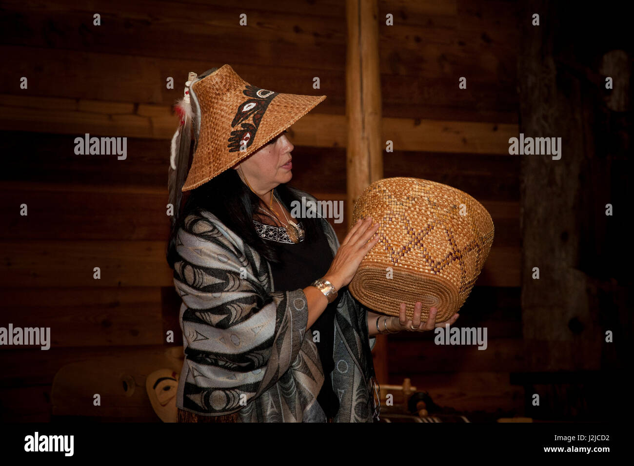 Tulalip Tribal member dressed in traditional woven cedar bark conical