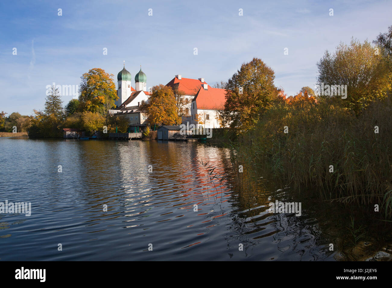 View over the monastery lake to Seeon monastery, Chiemgau region, Bavaria, Germany Stock Photo