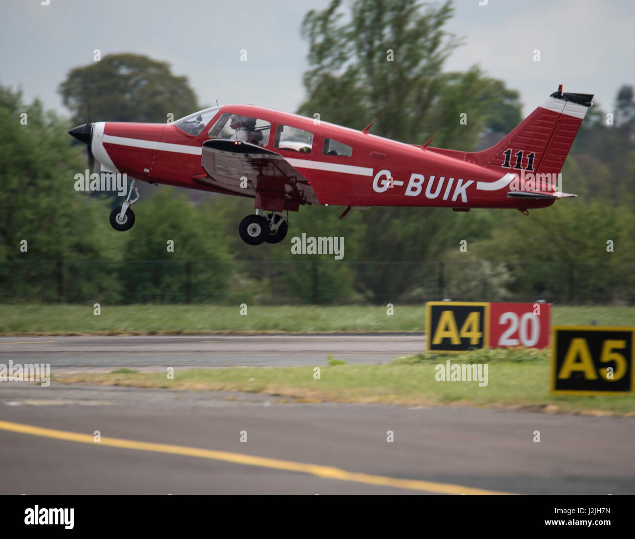 Piper PA-28-161 G-BUIL takes off from North  Weald airfield Stock Photo
