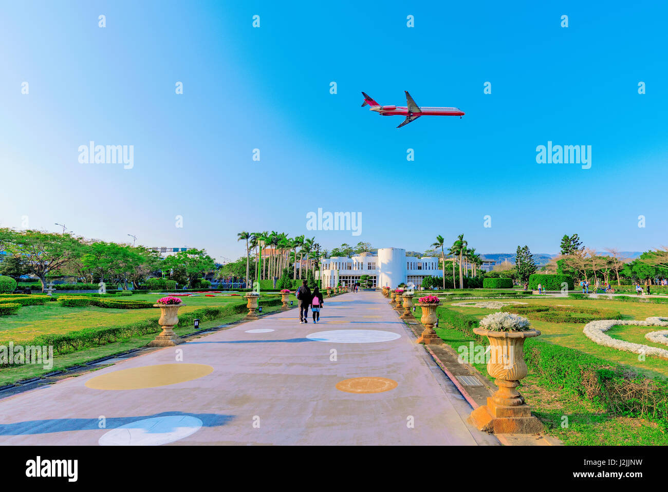 Taiwan expo park landscape with a plane flying over Stock Photo
