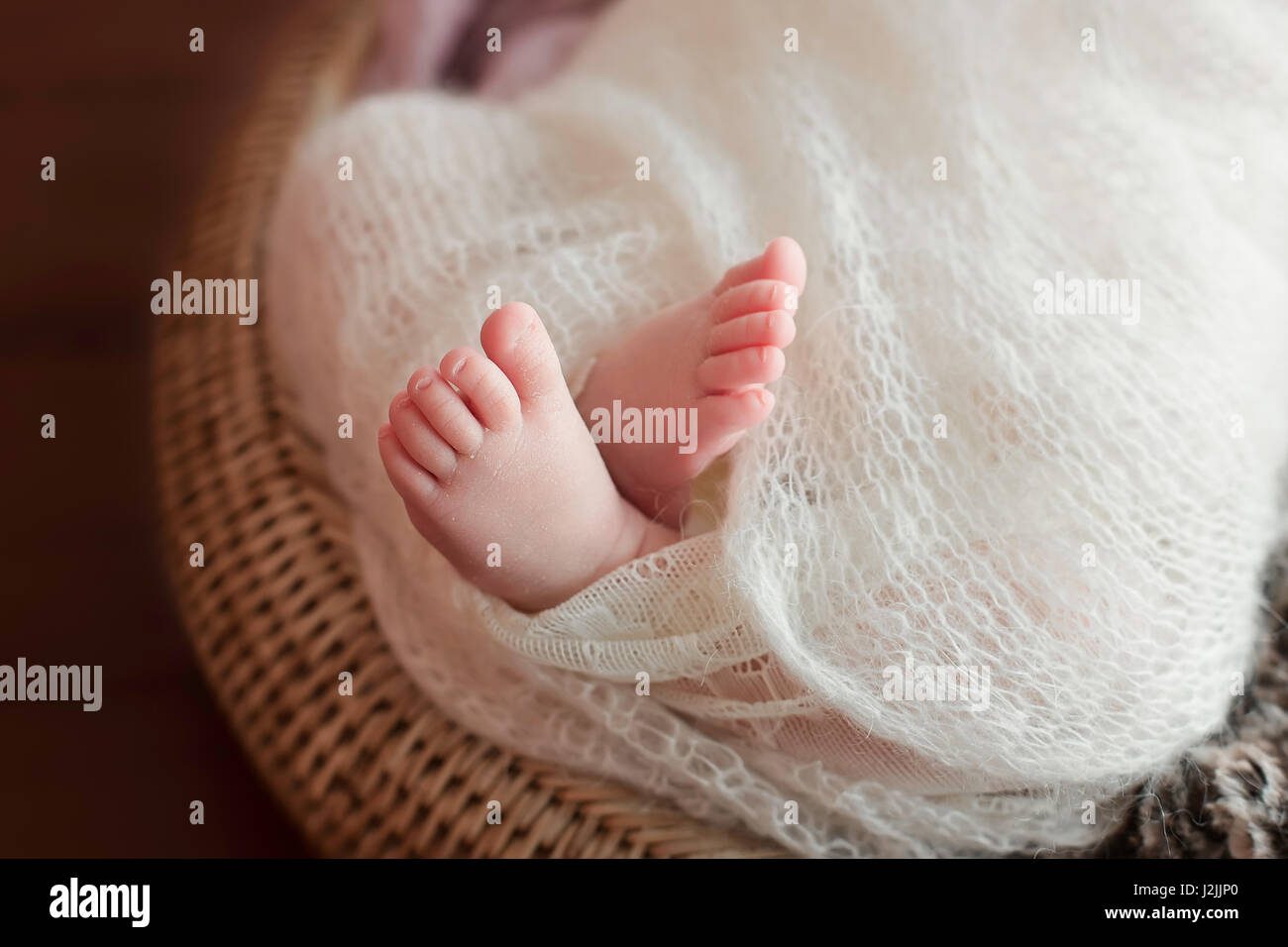 Tiny Newborn Baby's feet. Beautiful conceptual image of Maternity Stock Photo