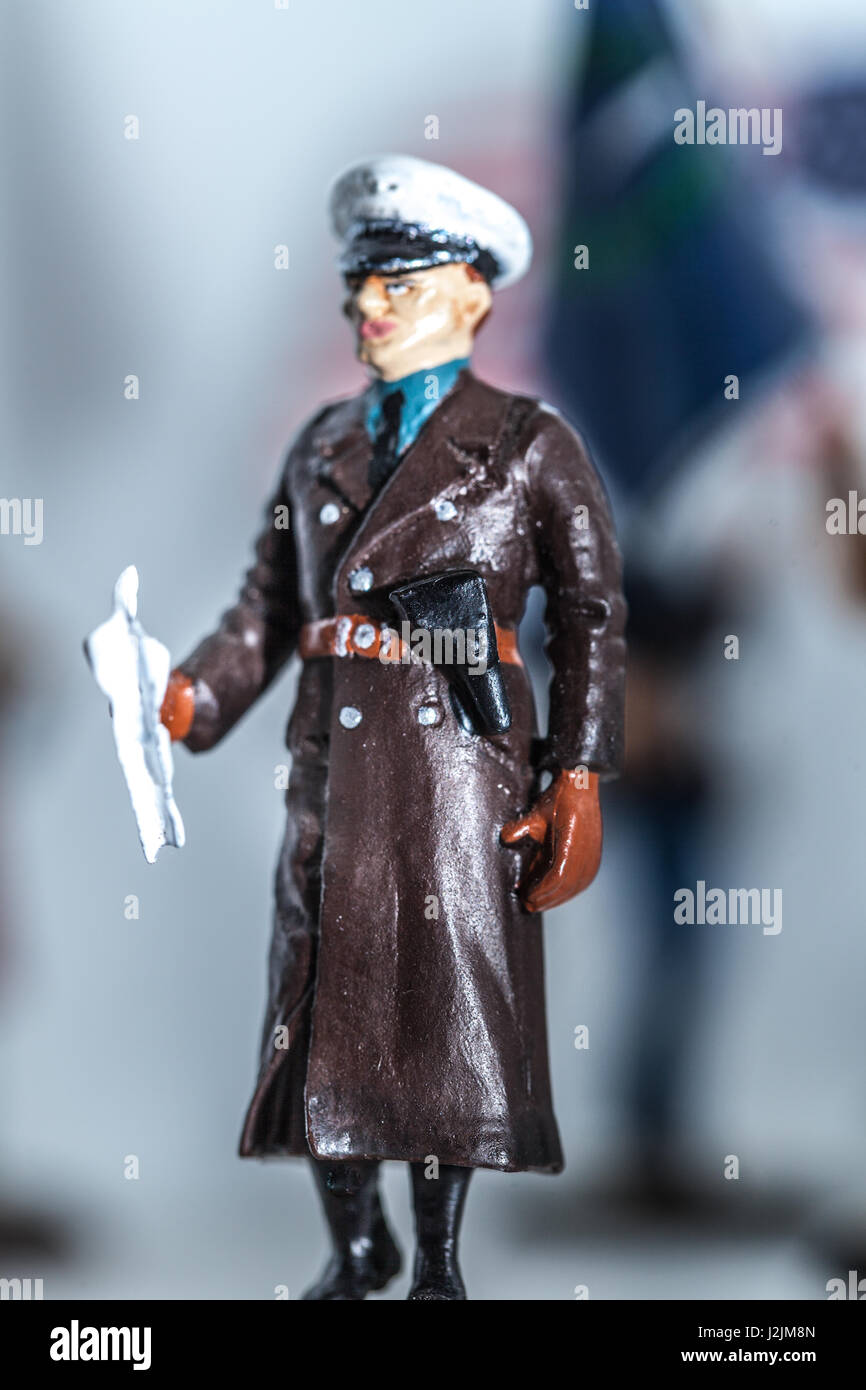 Tiny miniature vintage gestapo officer figurine standing Stock Photo