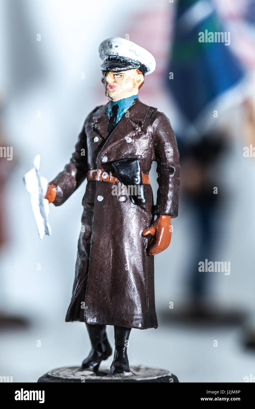 Tiny miniature vintage gestapo officer figurine standing Stock Photo