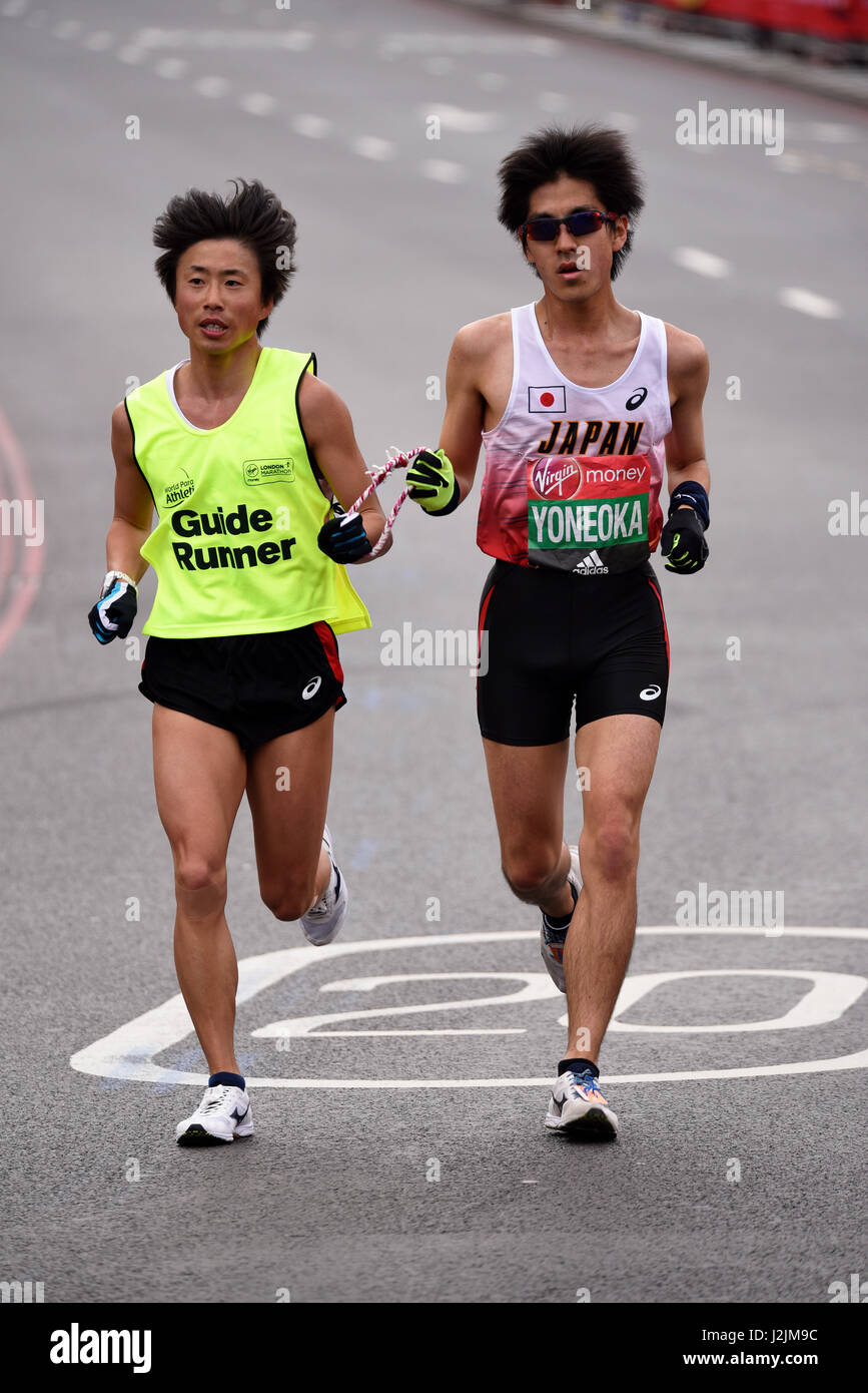 Satoru Yoneoka taking part in the 2017 London Marathon T11/T12 IPC category for visual impairment with a guide runner Stock Photo
