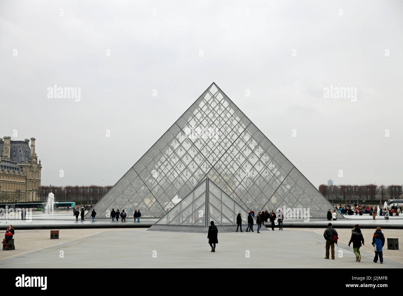 The Louvre Pyramid (Pyramide du Louvre) is a large glass and metal pyramid, designed by I. M. Pei, in the main courtyard of the Louvre Museum, Paris Stock Photo