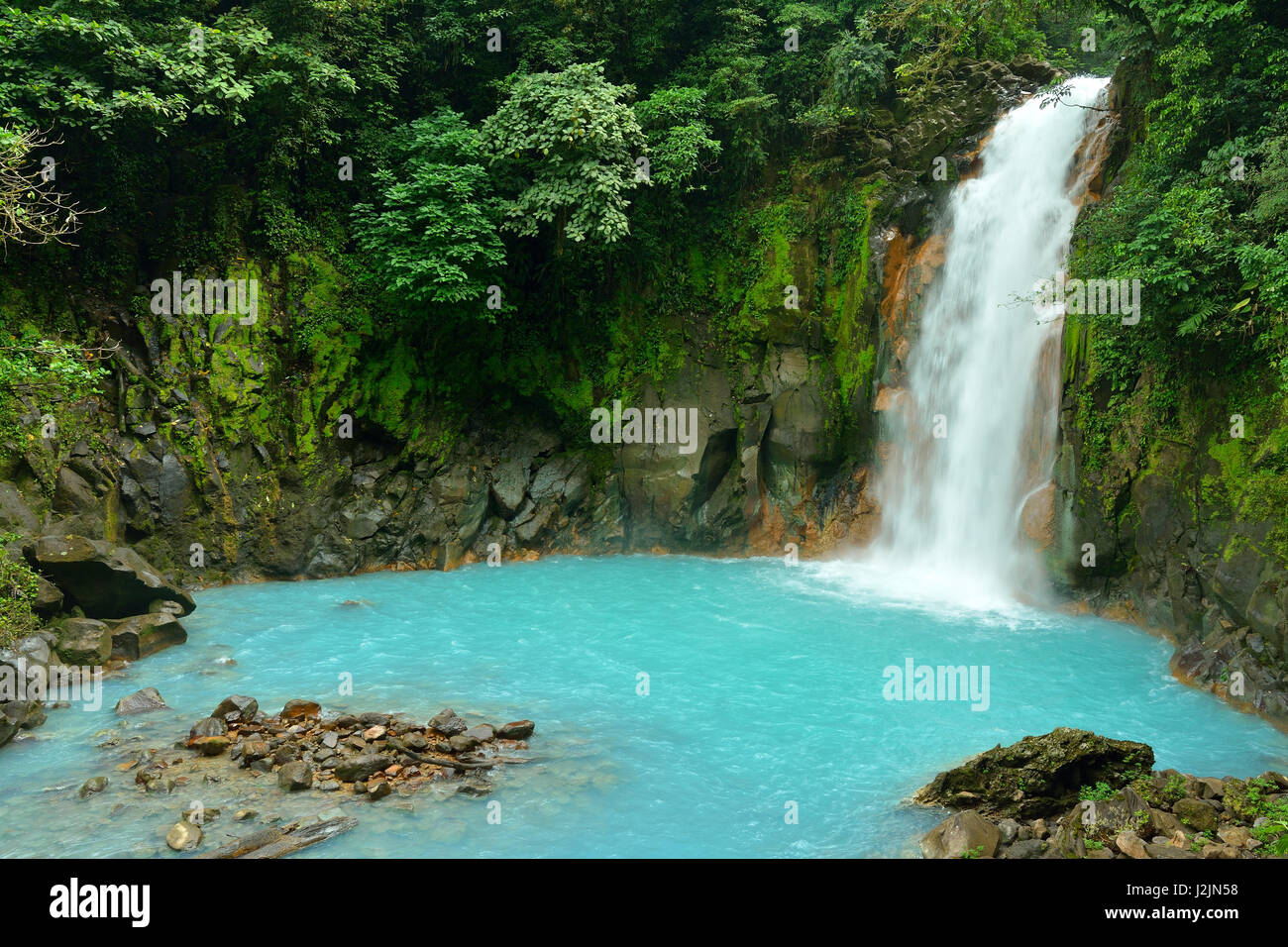 Waterfall with the blue waters of the Rio Celeste in Volcán Tenorio National Park, Costa Rica, Central America Stock Photo