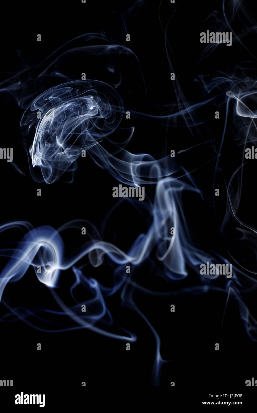 Abstract art. Color white blue smoke from the aromatic sticks on a