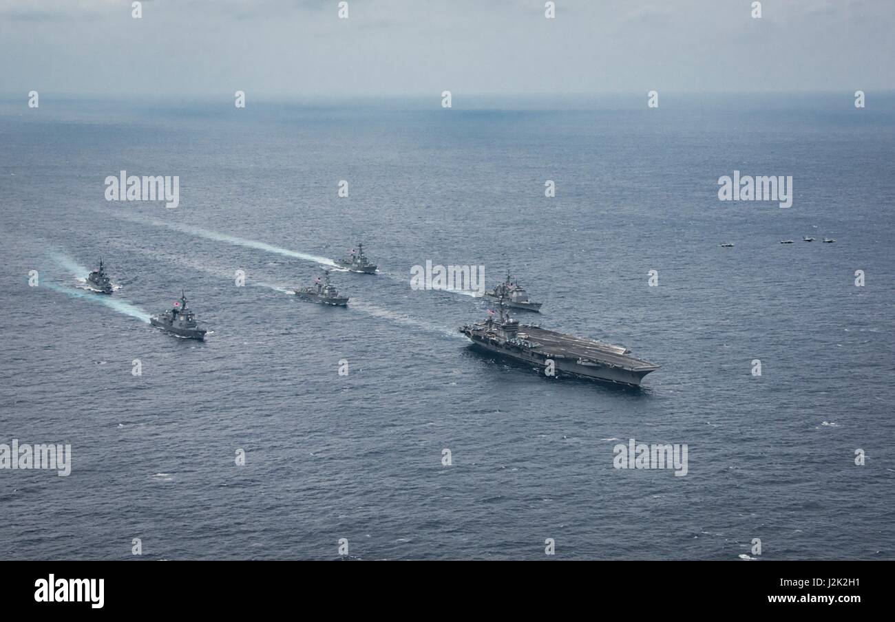Philippine Sea. 28th April, 2017. The U.S. Navy Nimitz-class aircraft carrier USS Carl Vinson underway with the Ticonderoga-class guided-missile cruiser USS Lake Champlain, Arleigh Burke-class guided-missile destroyer USS Michael Murphy, and USS Wayne E. Meyer the Japan Maritime Self-Defense Force Atago-class guided-missile destroyer JS Ashigara, and the Murasame-class destroyer JS Samidare April 28, 2017 in the Philippine Sea. The ships are heading toward South Korea as tensions continue to rise between the U.S. and North Korea. Credit: Planetpix/Alamy Live News Stock Photo