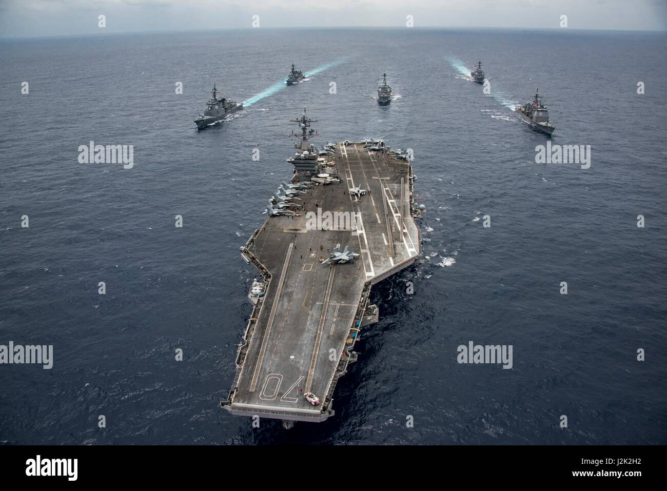 Philippine Sea. 28th April, 2017. The U.S. Navy Nimitz-class aircraft carrier USS Carl Vinson underway with the Ticonderoga-class guided-missile cruiser USS Lake Champlain, Arleigh Burke-class guided-missile destroyer USS Michael Murphy, and USS Wayne E. Meyer the Japan Maritime Self-Defense Force Atago-class guided-missile destroyer JS Ashigara, and the Murasame-class destroyer JS Samidare April 28, 2017 in the Philippine Sea. The ships are heading toward South Korea as tensions continue to rise between the U.S. and North Korea. Credit: Planetpix/Alamy Live News Stock Photo