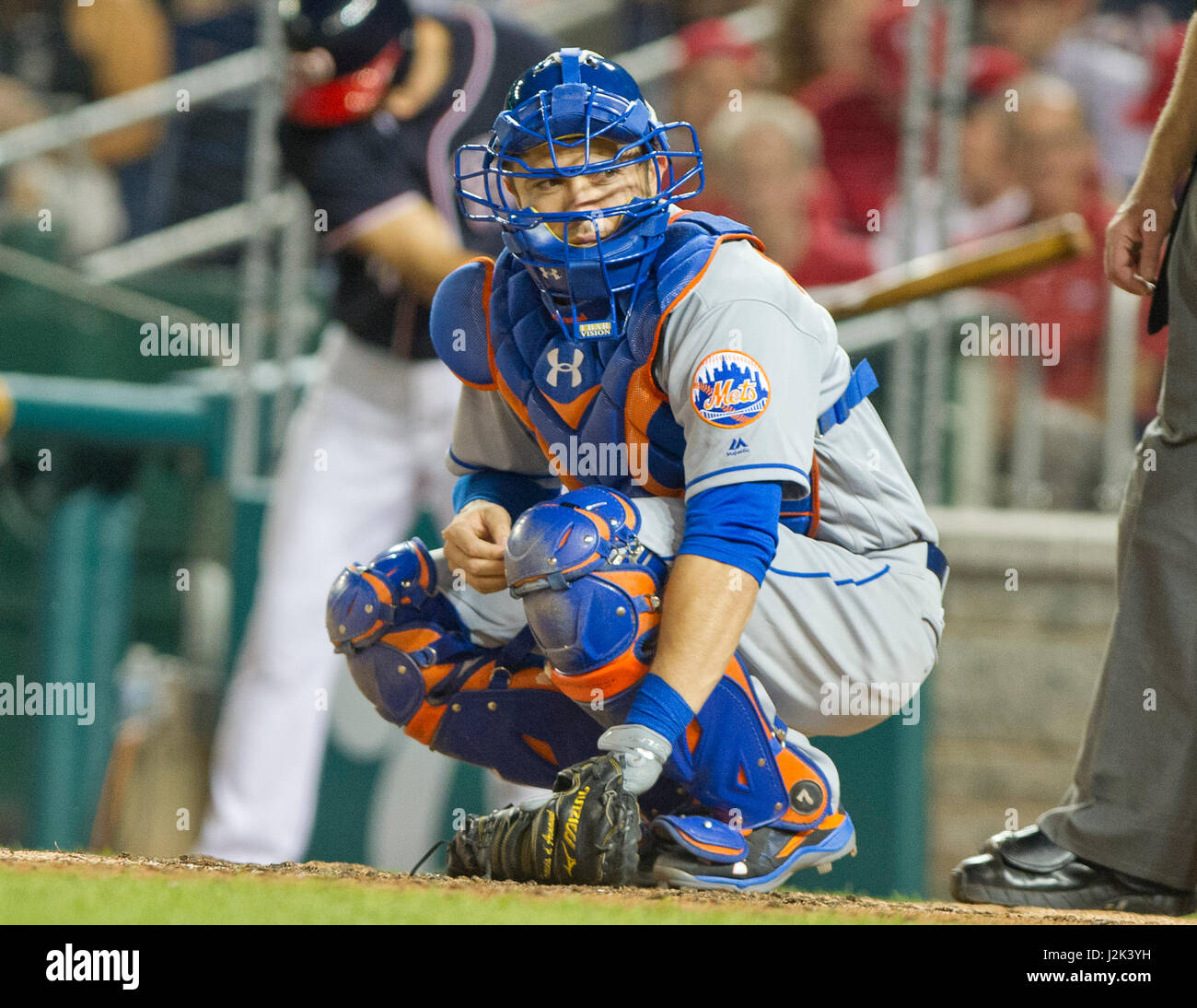 New York Mets catcher Travis d'Arnaud (18) looks towards the dugout for signs as the Washington Nationals bat in the fifth inning at Nationals Park in Washington, D.C. on Friday, April 28, 2017. Credit: Ron Sachs / CNP /MediaPunch Stock Photo