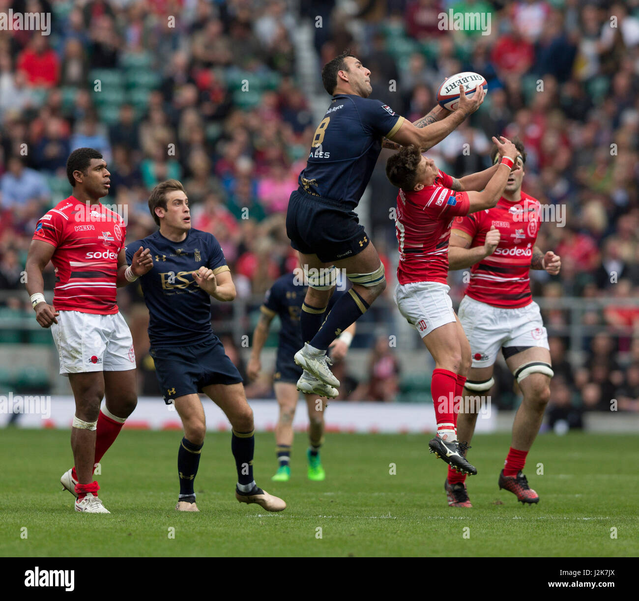 Players compete in the air for the ball in the 100th fixture of the Army v Navy rugby match at Twickenham, played for the Babcock Trophy. Stock Photo