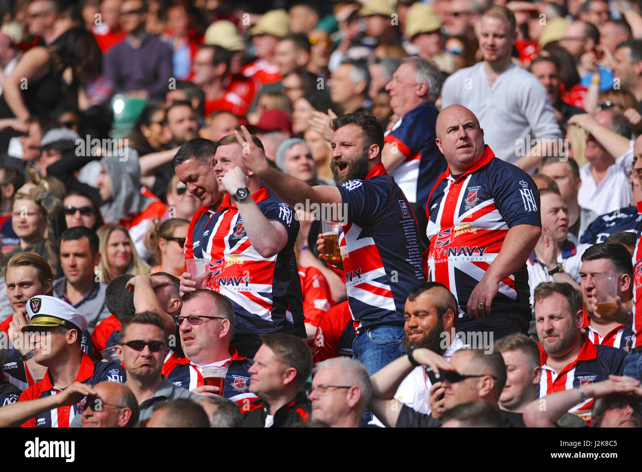 London, UK. 29th Apr, 2017. Patriotic rugby fans at the 100th annual Army Navy Rugby Match, Twickenham Stadium, London, UK.  The match is the annual rugby union match played between the senior XV teams of the Royal Navy and British Army and marks the culmination of the annual Inter-Services Competition. Credit: Michael Preston/Alamy Live News Stock Photo